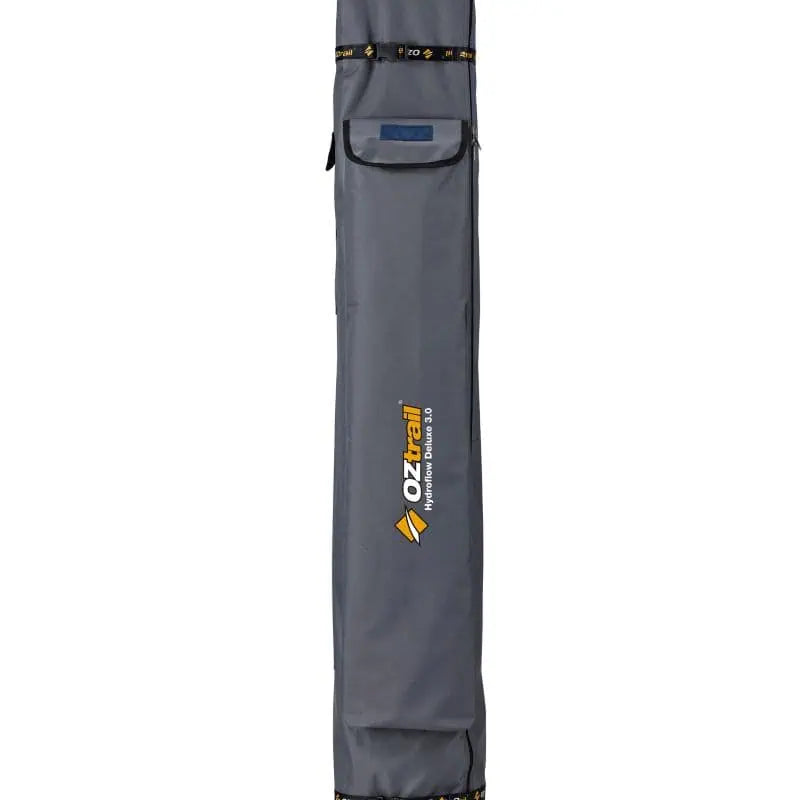 A tall, grey heavy-duty carry bag with the OZtrail Hydroflow Deluxe 3.0 logo and black branded straps.