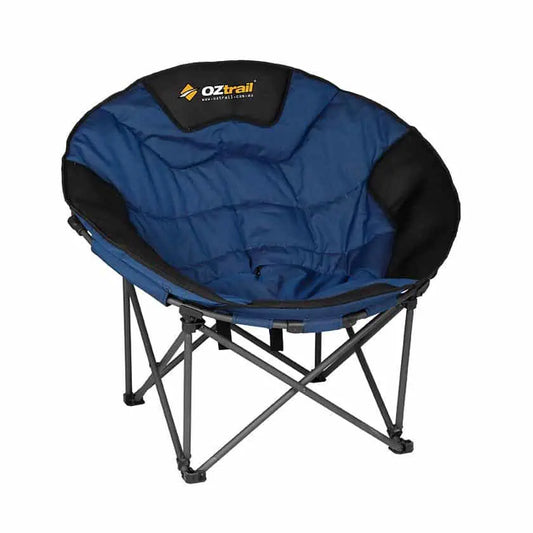 A blue and black OZtrail Moon Chair Jumbo featuring a wide, quilted circular padded seat and a sturdy black cross-braced folding frame