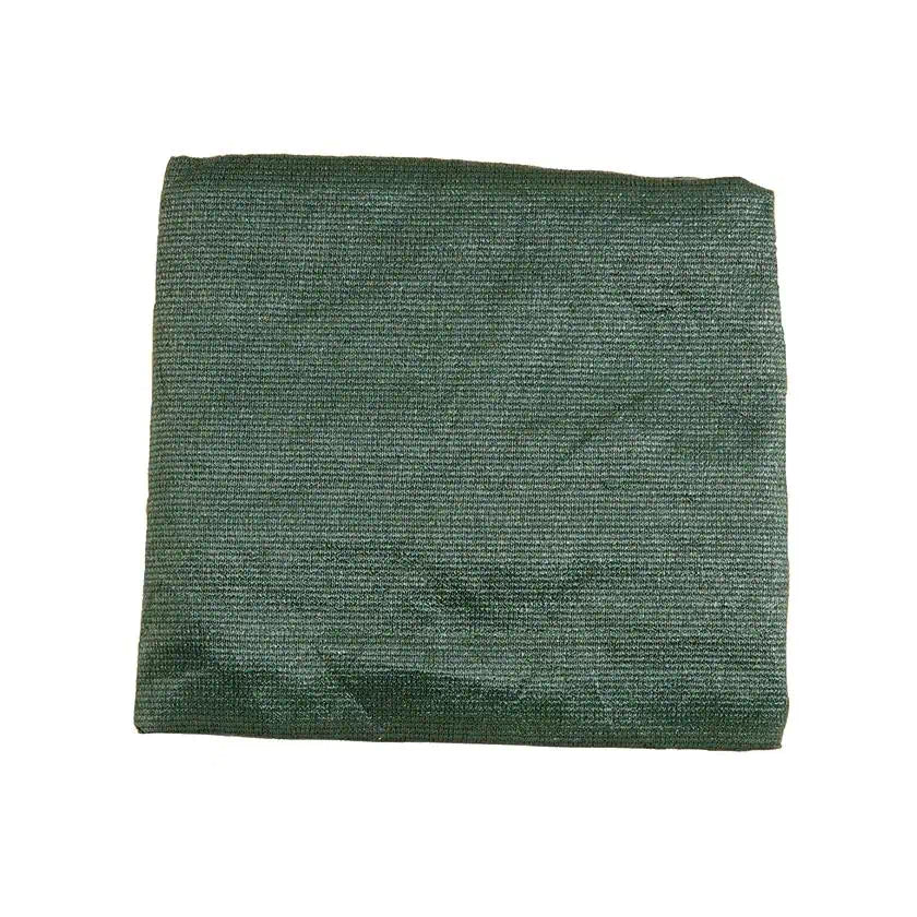 A green Ultramesh tarp or floor mat, folded into a square, designed to protect tent floors and provide a clean campsite area