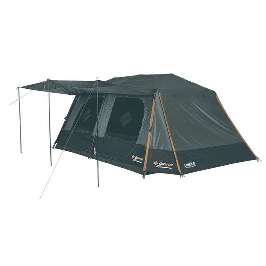  A large dark grey OZtrail Fast Frame Headland 10-person tent with orange trim, featuring two internal rooms and a set-up front awning.