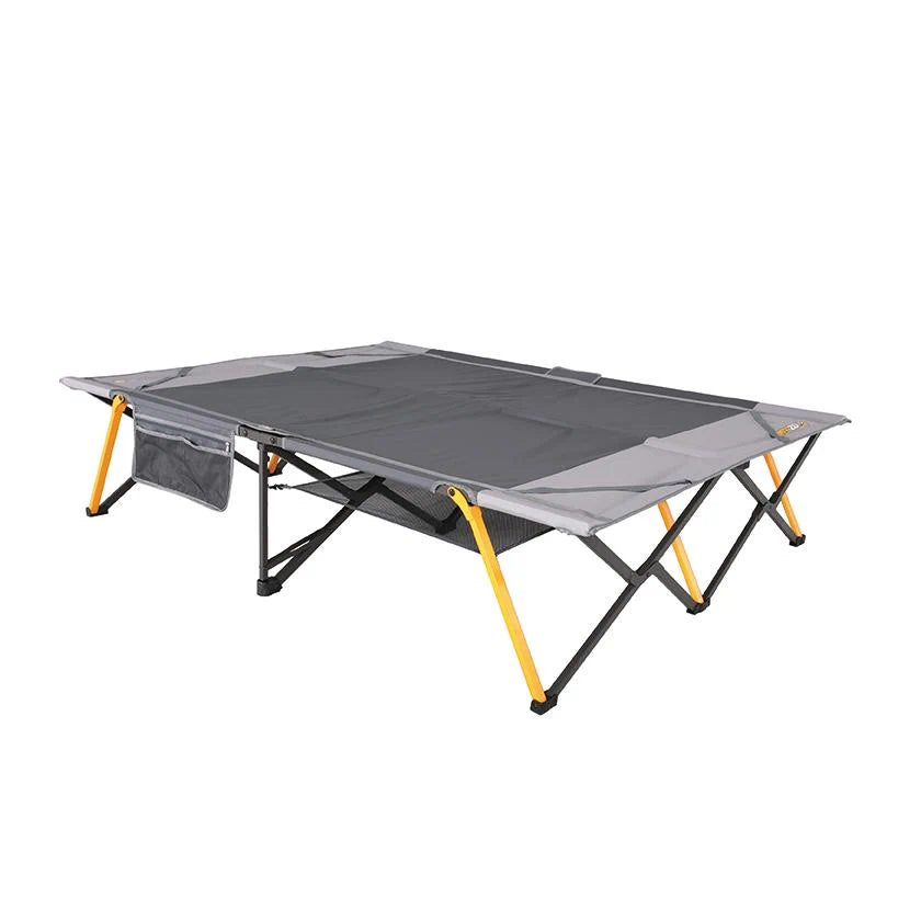A fully assembled queen-sized easy fold camping stretcher featuring a grey fabric surface and a sturdy yellow and black metal frame